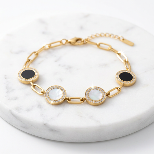 Bracelet stainless steel doré avec médaillons noirs et blancs