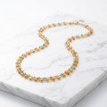 Collier stainless steel avec perles colorées oranje vert beige
